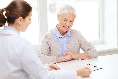 An elderly woman having a consultation with a doctor | Medigap Plans